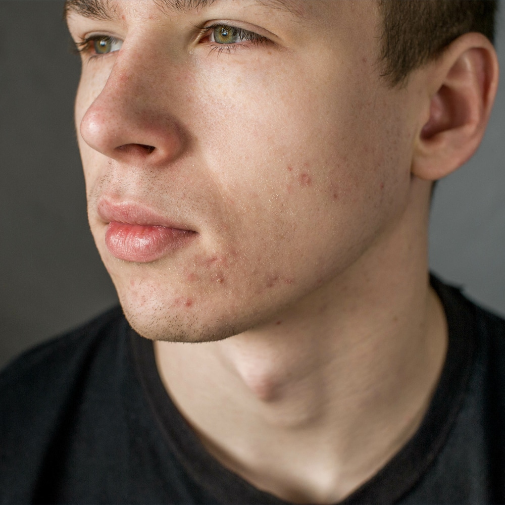 a close up of a man looking at the camera