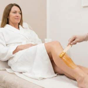sugar wax being applied to leg