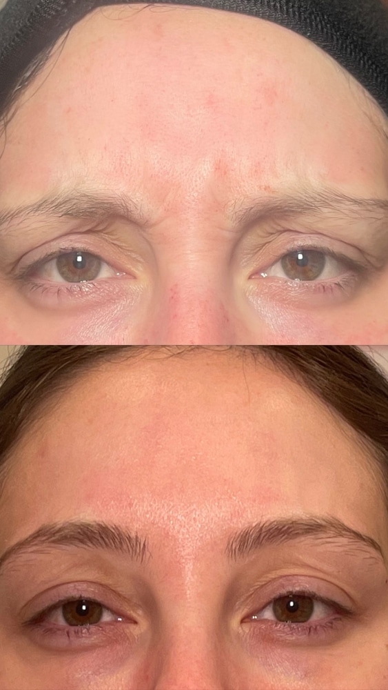 a close up of a person wearing glasses and smiling at the camera