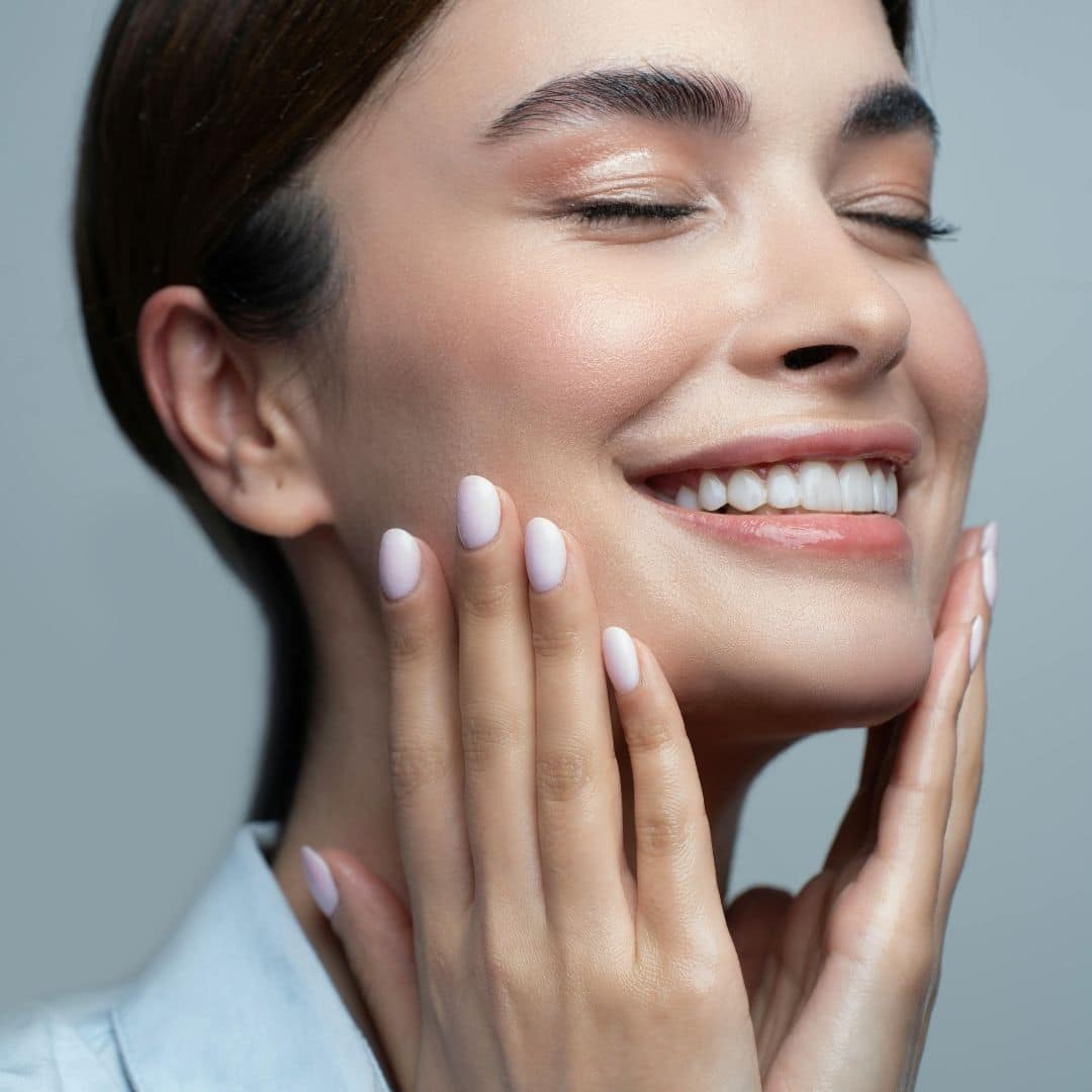 a woman touching her face